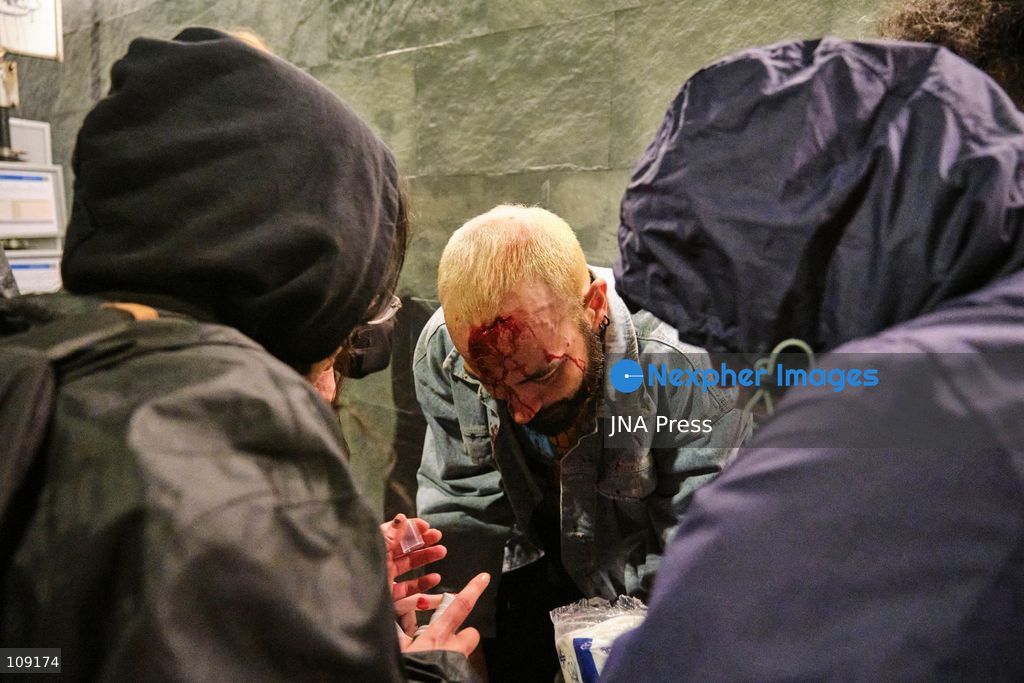 BOLOGNA, ITALY - OCTOBER 24, 2026: Thousands of people gathered spontaneously in Piazza del Nettuno before setting off in a march through the city centre. Clashes broke out along Via Marconi. Several people were injured, and a young man lost consciousness after being tackled by police. A police water cannon was also used from behind the protesters and hit the ambulance that was assisting the unconscious man. In protest, demonstrators sat down in front of the police line, which, after several minutes, decided to disband its wall of shields. (Photo by Lorenzo Pasini/JNA Press via Nexpher Images)