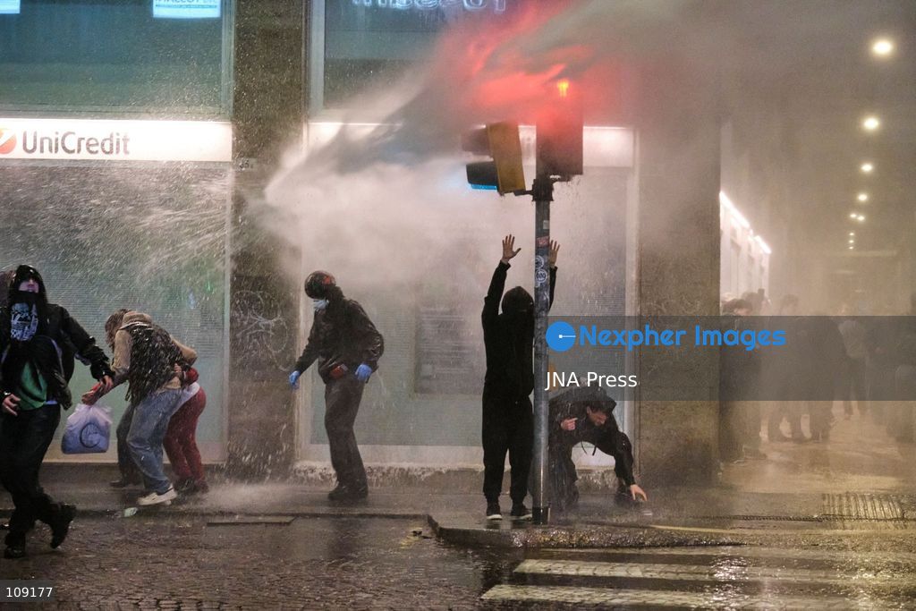 BOLOGNA, ITALY - OCTOBER 24, 2026: Thousands of people gathered spontaneously in Piazza del Nettuno before setting off in a march through the city centre. Clashes broke out along Via Marconi. Several people were injured, and a young man lost consciousness after being tackled by police. A police water cannon was also used from behind the protesters and hit the ambulance that was assisting the unconscious man. In protest, demonstrators sat down in front of the police line, which, after several minutes, decided to disband its wall of shields. (Photo by Lorenzo Pasini/JNA Press via Nexpher Images)