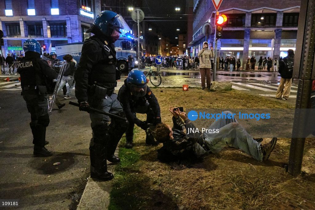 BOLOGNA, ITALY - OCTOBER 24, 2026: Thousands of people gathered spontaneously in Piazza del Nettuno before setting off in a march through the city centre. Clashes broke out along Via Marconi. Several people were injured, and a young man lost consciousness after being tackled by police. A police water cannon was also used from behind the protesters and hit the ambulance that was assisting the unconscious man. In protest, demonstrators sat down in front of the police line, which, after several minutes, decided to disband its wall of shields. (Photo by Lorenzo Pasini/JNA Press via Nexpher Images)