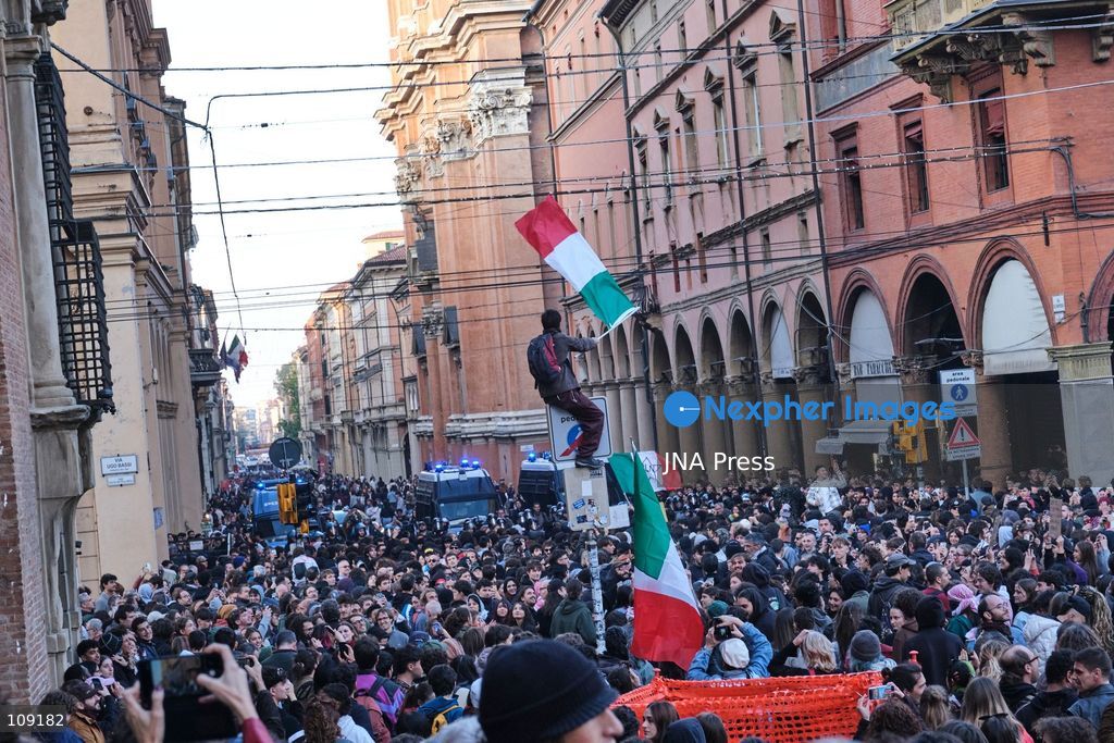 BOLOGNA, ITALY - OCTOBER 24, 2026: Thousands of people gathered spontaneously in Piazza del Nettuno before setting off in a march through the city centre. Clashes broke out along Via Marconi. Several people were injured, and a young man lost consciousness after being tackled by police. A police water cannon was also used from behind the protesters and hit the ambulance that was assisting the unconscious man. In protest, demonstrators sat down in front of the police line, which, after several minutes, decided to disband its wall of shields. (Photo by Lorenzo Pasini/JNA Press via Nexpher Images)