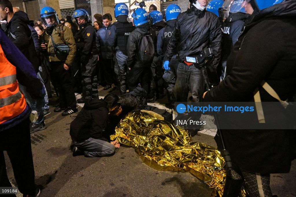 BOLOGNA, ITALY - OCTOBER 24, 2026: Thousands of people gathered spontaneously in Piazza del Nettuno before setting off in a march through the city centre. Clashes broke out along Via Marconi. Several people were injured, and a young man lost consciousness after being tackled by police. A police water cannon was also used from behind the protesters and hit the ambulance that was assisting the unconscious man. In protest, demonstrators sat down in front of the police line, which, after several minutes, decided to disband its wall of shields. (Photo by Lorenzo Pasini/JNA Press via Nexpher Images)