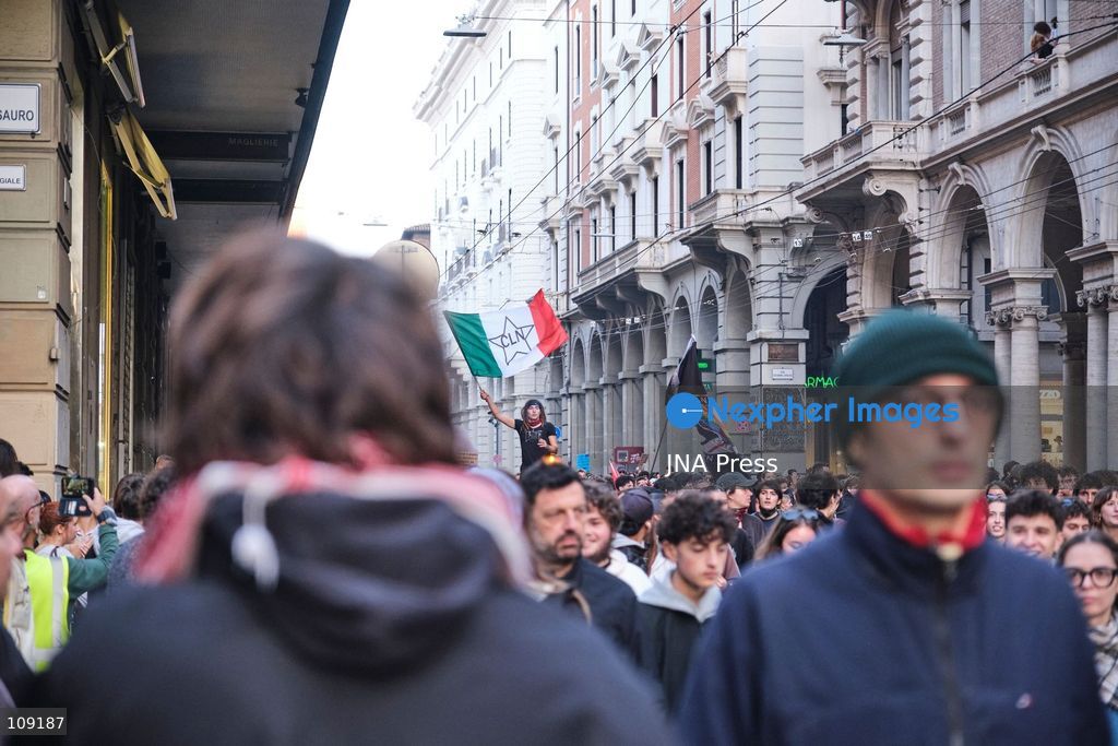 BOLOGNA, ITALY - OCTOBER 24, 2026: Thousands of people gathered spontaneously in Piazza del Nettuno before setting off in a march through the city centre. Clashes broke out along Via Marconi. Several people were injured, and a young man lost consciousness after being tackled by police. A police water cannon was also used from behind the protesters and hit the ambulance that was assisting the unconscious man. In protest, demonstrators sat down in front of the police line, which, after several minutes, decided to disband its wall of shields. (Photo by Lorenzo Pasini/JNA Press via Nexpher Images)