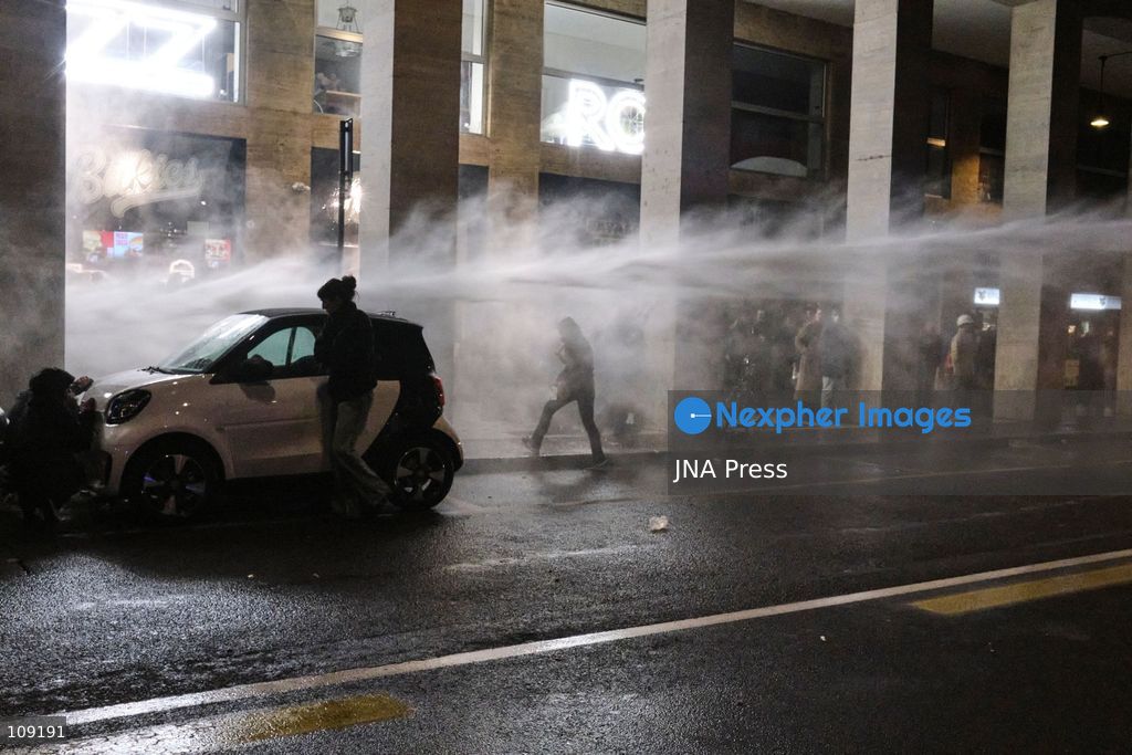 BOLOGNA, ITALY - OCTOBER 24, 2026: Thousands of people gathered spontaneously in Piazza del Nettuno before setting off in a march through the city centre. Clashes broke out along Via Marconi. Several people were injured, and a young man lost consciousness after being tackled by police. A police water cannon was also used from behind the protesters and hit the ambulance that was assisting the unconscious man. In protest, demonstrators sat down in front of the police line, which, after several minutes, decided to disband its wall of shields. (Photo by Lorenzo Pasini/JNA Press via Nexpher Images)