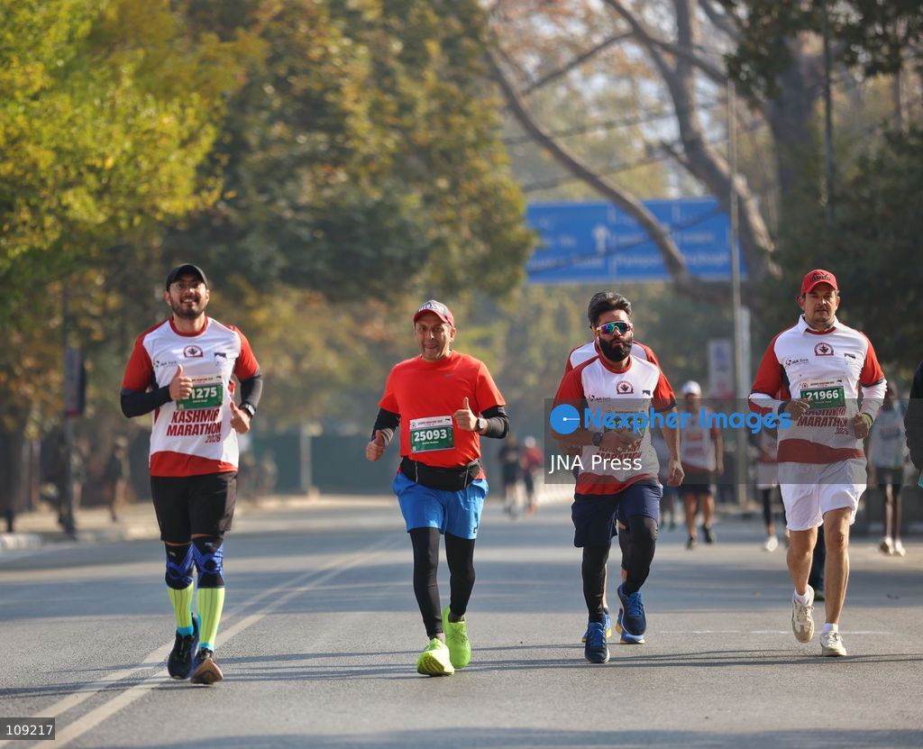 SRINAGAR, INDIA - OCTOBER 25, 2026: Participants run during the third edition of the Kashmir International Marathon in Srinagar, Jammu and Kashmir. Runners, including international athletes from 12 countries, take part in the event, which features a 42.195-kilometre full marathon and a 21-kilometre half marathon. The routes pass through scenic locations, including Dal Lake, Boulevard Road and Nishat Garden, highlighting Kashmir's natural beauty and growing potential for sports tourism. (Photo by Sameer Hussain/JNA Press via Nexpher Images)