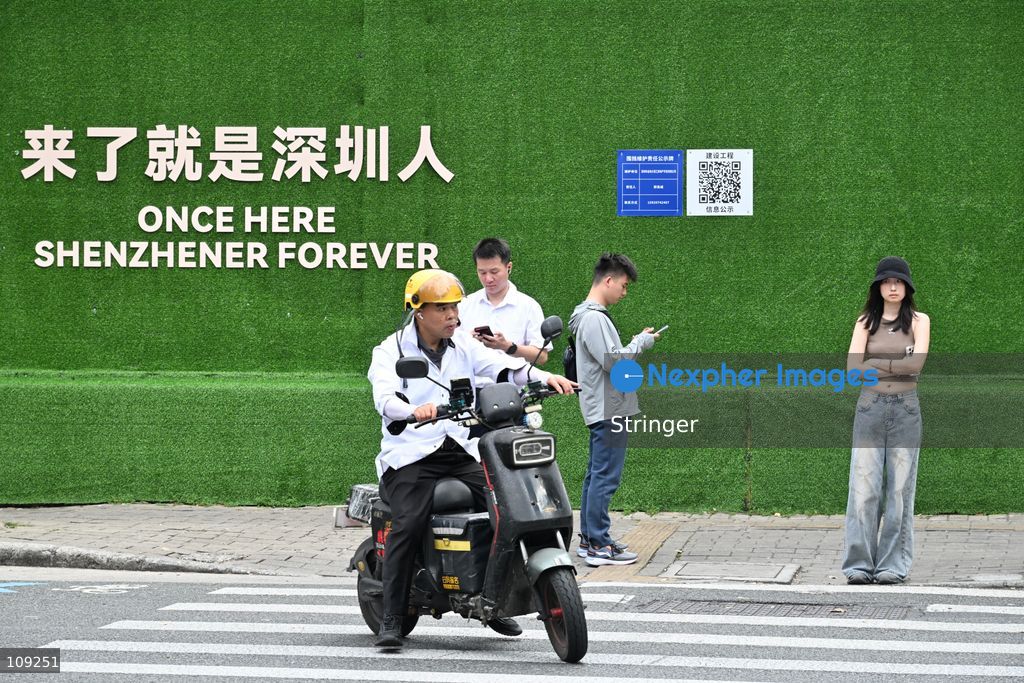 A general view showing people waiting crossing the street on October 25, 2026 in Shenzhen, China. (Photo by Stringer/Nexpher Images)