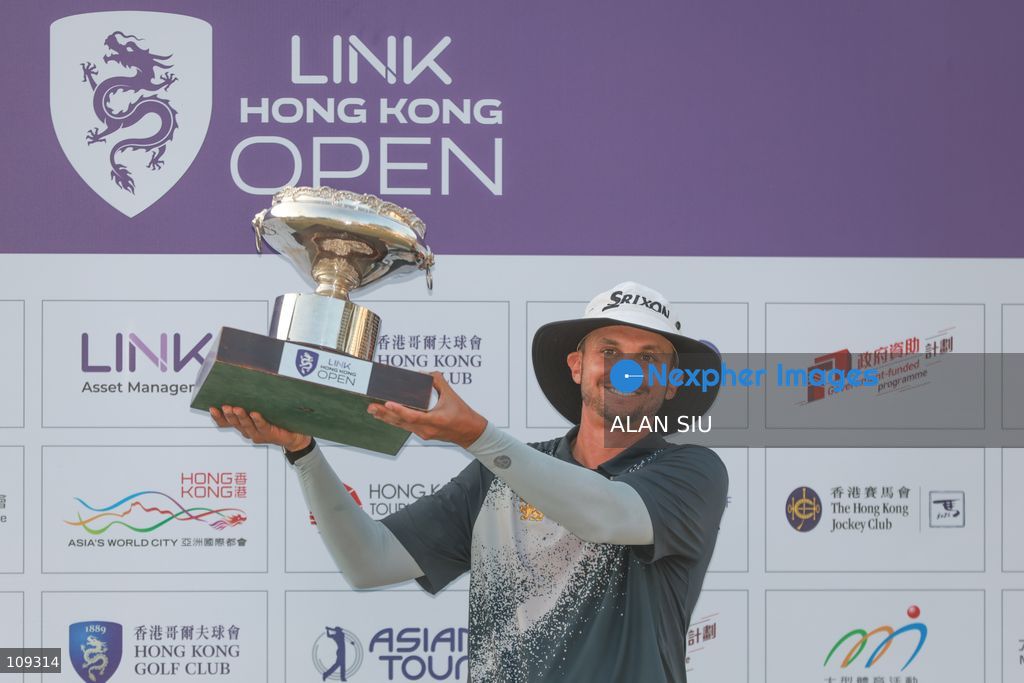 John Catlin of USA poses with trophy after winning The Link Hong Kong Open at the Hong Kong Golf Club in Faning on October 25, 2026 in Hong Kong. (Photo by ALAN SIU/Nexpher Images)
