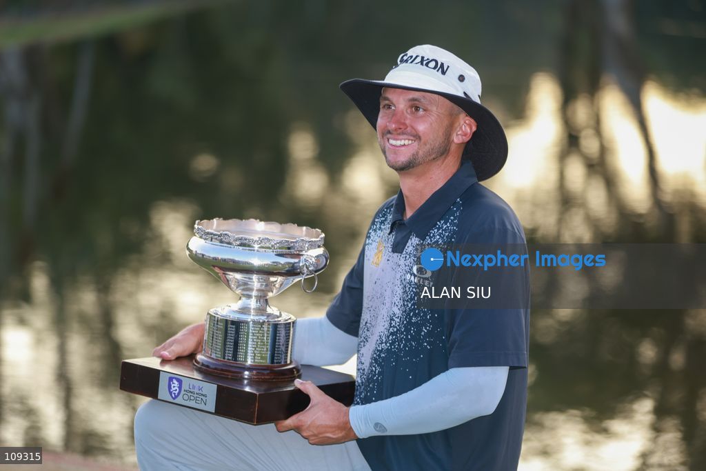John Catlin of USA poses with trophy after winning The Link Hong Kong Open at the Hong Kong Golf Club in Faning on October 25, 2026 in Hong Kong. (Photo by ALAN SIU/Nexpher Images)