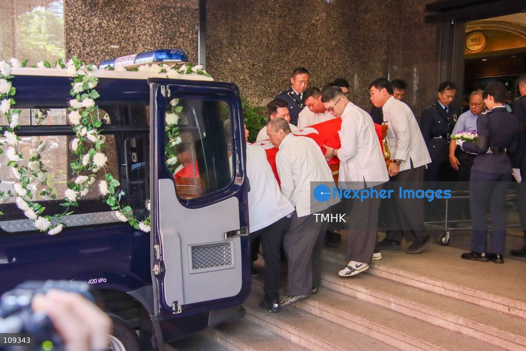 Funeral parlour staff place the coffin of late police officer Chu Chun-kwok into a hearse outside the Universal Funeral Parlour in Hung Hom, Hong Kong, on October 23, 2026, following a funeral with full police honours. (Photo by Gordon Choi/TMHK via Nexpher Images)