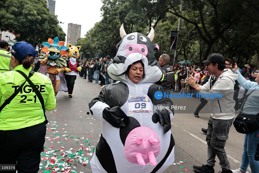Mascots in various character and animal forms begin to reach the finish line during the second edition of the Mascot Race on October 24, 2026, in Mexico City, Mexico. The Mexico City Secretariat of Citizen Security held its second annual Mascot Race, which took place as part of the Day of the Dead festivities. The 52 competitors wore oversized costumes to race along one of the city’s main avenues, delighting the attendees who enjoyed watching these mascots dash toward victory. (Photo by Josue Pérez/Nexpher Images)