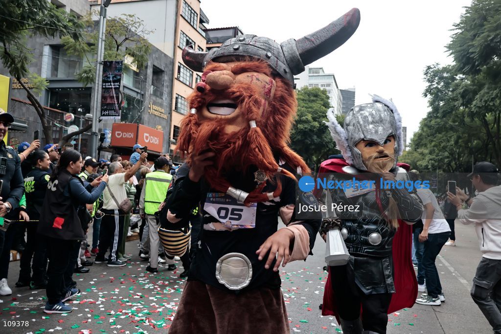 Mascots in various character and animal forms begin to reach the finish line during the second edition of the Mascot Race on October 24, 2026, in Mexico City, Mexico. The Mexico City Secretariat of Citizen Security held its second annual Mascot Race, which took place as part of the Day of the Dead festivities. The 52 competitors wore oversized costumes to race along one of the city’s main avenues, delighting the attendees who enjoyed watching these mascots dash toward victory. (Photo by Josue Pérez/Nexpher Images)
