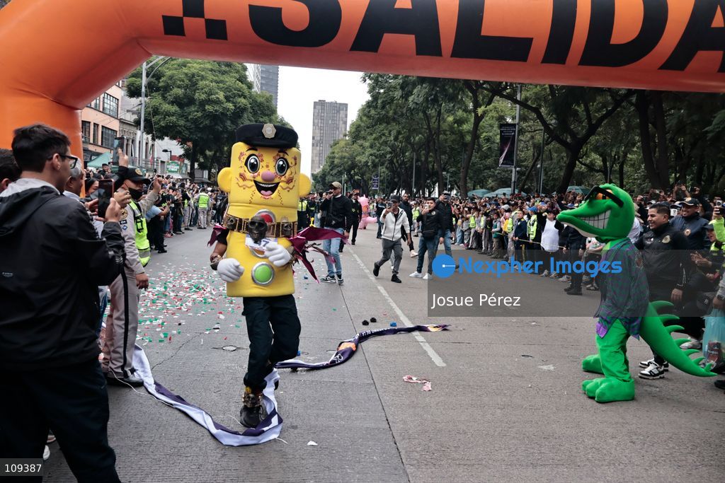 Semaforin was the winner of the second mascot race on October 24, 2026, in Mexico City, Mexico. The Mexico City Secretariat of Citizen Security held its second annual Mascot Race, which took place as part of the Day of the Dead festivities. The 52 competitors wore oversized costumes to race along one of the city’s main avenues, delighting the attendees who enjoyed watching these mascots dash toward victory. (Photo by Josue Pérez/Nexpher Images)
