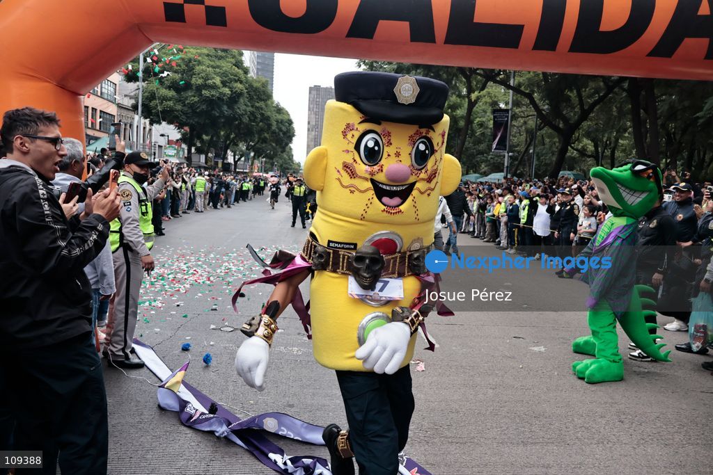 Semaforin was the winner of the second mascot race on October 24, 2026, in Mexico City, Mexico. The Mexico City Secretariat of Citizen Security held its second annual Mascot Race, which took place as part of the Day of the Dead festivities. The 52 competitors wore oversized costumes to race along one of the city’s main avenues, delighting the attendees who enjoyed watching these mascots dash toward victory. (Photo by Josue Pérez/Nexpher Images)