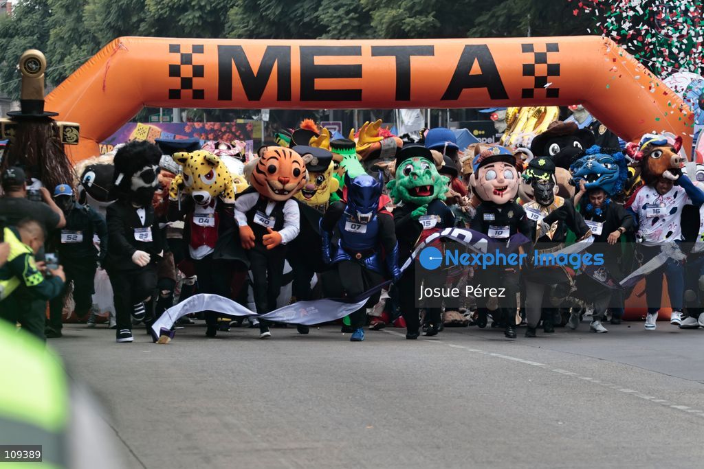 Competitors in the second edition of the mascot race wait to start from the starting line on October 24, 2026, in Mexico City, Mexico. The Mexico City Secretariat of Citizen Security held its second annual Mascot Race, which took place as part of the Day of the Dead festivities. The 52 competitors wore oversized costumes to race along one of the city’s main avenues, delighting the attendees who enjoyed watching these mascots dash toward victory. (Photo by Josue Pérez/Nexpher Images)