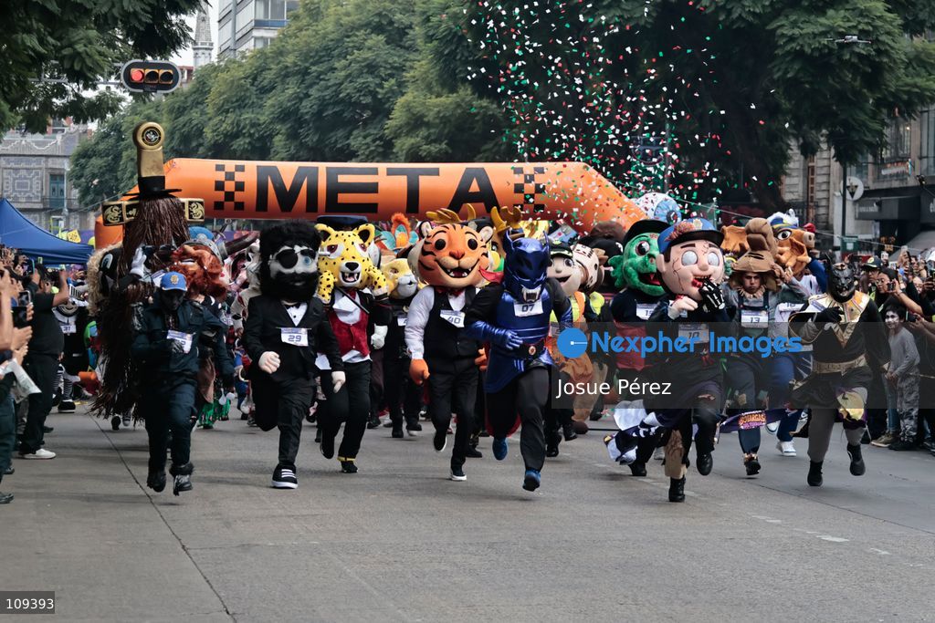 Competitors in the second edition of the mascot race wait to start from the starting line on October 24, 2026, in Mexico City, Mexico.The Mexico City Secretariat of Citizen Security held its second annual Mascot Race, which took place as part of the Day of the Dead festivities. The 52 competitors wore oversized costumes to race along one of the city’s main avenues, delighting the attendees who enjoyed watching these mascots dash toward victory. (Photo by Josue Pérez/Nexpher Images)