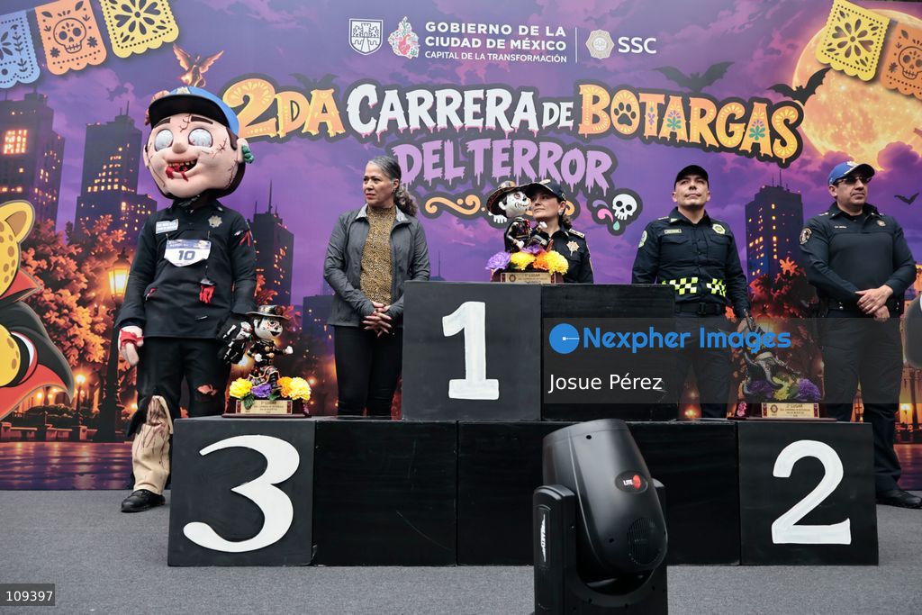 The prize presentation ceremony on October 24, 2026, in Mexico City, Mexico.The Mexico City Secretariat of Citizen Security held its second annual Mascot Race, which took place as part of the Day of the Dead festivities. The 52 competitors wore oversized costumes to race along one of the city’s main avenues, delighting the attendees who enjoyed watching these mascots dash toward victory. (Photo by Josue Pérez/Nexpher Images)