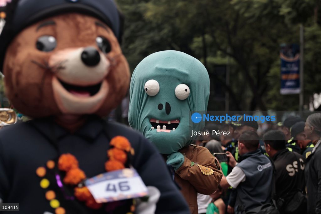 Mascots in various character and animal forms begin to reach the finish line during the second edition of the Mascot Race on October 24, 2026, in Mexico City, Mexico. The Mexico City Secretariat of Citizen Security held its second annual Mascot Race, which took place as part of the Day of the Dead festivities. The 52 competitors wore oversized costumes to race along one of the city’s main avenues, delighting the attendees who enjoyed watching these mascots dash toward victory. (Photo by Josue Pérez/Nexpher Images)