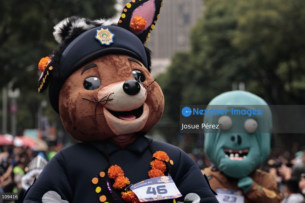 Mascots in various character and animal forms begin to reach the finish line during the second edition of the Mascot Race on October 24, 2026, in Mexico City, Mexico. The Mexico City Secretariat of Citizen Security held its second annual Mascot Race, which took place as part of the Day of the Dead festivities. The 52 competitors wore oversized costumes to race along one of the city’s main avenues, delighting the attendees who enjoyed watching these mascots dash toward victory. (Photo by Josue Pérez/Nexpher Images)