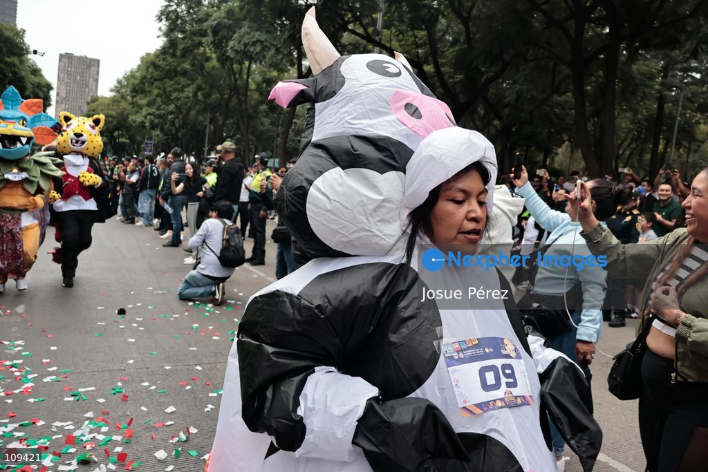 Mascots in various character and animal forms begin to reach the finish line during the second edition of the Mascot Race on October 24, 2026, in Mexico City, Mexico. The Mexico City Secretariat of Citizen Security held its second annual Mascot Race, which took place as part of the Day of the Dead festivities. The 52 competitors wore oversized costumes to race along one of the city’s main avenues, delighting the attendees who enjoyed watching these mascots dash toward victory. (Photo by Josue Pérez/Nexpher Images)
