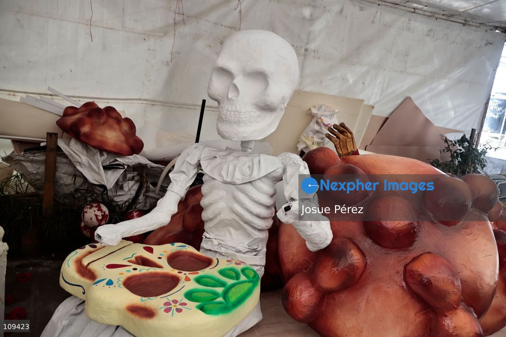 Pieces of the parade float for the Day of the Dead parade are being placed in various locations to keep them organized, on October 24, 2026, in Mexico City, Mexico. At the Arts and Trades Factory of the East (FARO de Oriente), located in the Iztapalapa district, one of the floats for the Day of the Dead parade is being constructed. Titled "Panadero con el pan" ("Baker with the Bread"), the float is being built by artisans who specialize in alebrijes (fantastical creatures) and cartonería (traditional papier-mache/cardboard craft). They are crafting skulls, calaveras (stylized skeletal figures), and pan de muerto (traditional Day of the Dead bread) to assemble the float, which will also feature cempasúchil (marigold) flowers. (Photo by Josue Pérez/Nexpher Images)