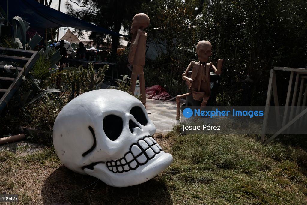 Pieces of the parade float for the Day of the Dead parade are being placed in various locations to keep them organized, on October 24, 2026, in Mexico City, Mexico. At the Arts and Trades Factory of the East (FARO de Oriente), located in the Iztapalapa district, one of the floats for the Day of the Dead parade is being constructed. Titled "Panadero con el pan" ("Baker with the Bread"), the float is being built by artisans who specialize in alebrijes (fantastical creatures) and cartonería (traditional papier-mache/cardboard craft). They are crafting skulls, calaveras (stylized skeletal figures), and pan de muerto (traditional Day of the Dead bread) to assemble the float, which will also feature cempasúchil (marigold) flowers. (Photo by Josue Pérez/Nexpher Images)