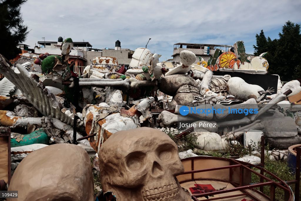 Pieces of the parade float for the Day of the Dead parade are being placed in various locations to keep them organized, on October 24, 2026, in Mexico City, Mexico. At the Arts and Trades Factory of the East (FARO de Oriente), located in the Iztapalapa district, one of the floats for the Day of the Dead parade is being constructed. Titled "Panadero con el pan" ("Baker with the Bread"), the float is being built by artisans who specialize in alebrijes (fantastical creatures) and cartonería (traditional papier-mache/cardboard craft). They are crafting skulls, calaveras (stylized skeletal figures), and pan de muerto (traditional Day of the Dead bread) to assemble the float, which will also feature cempasúchil (marigold) flowers. (Photo by Josue Pérez/Nexpher Images)