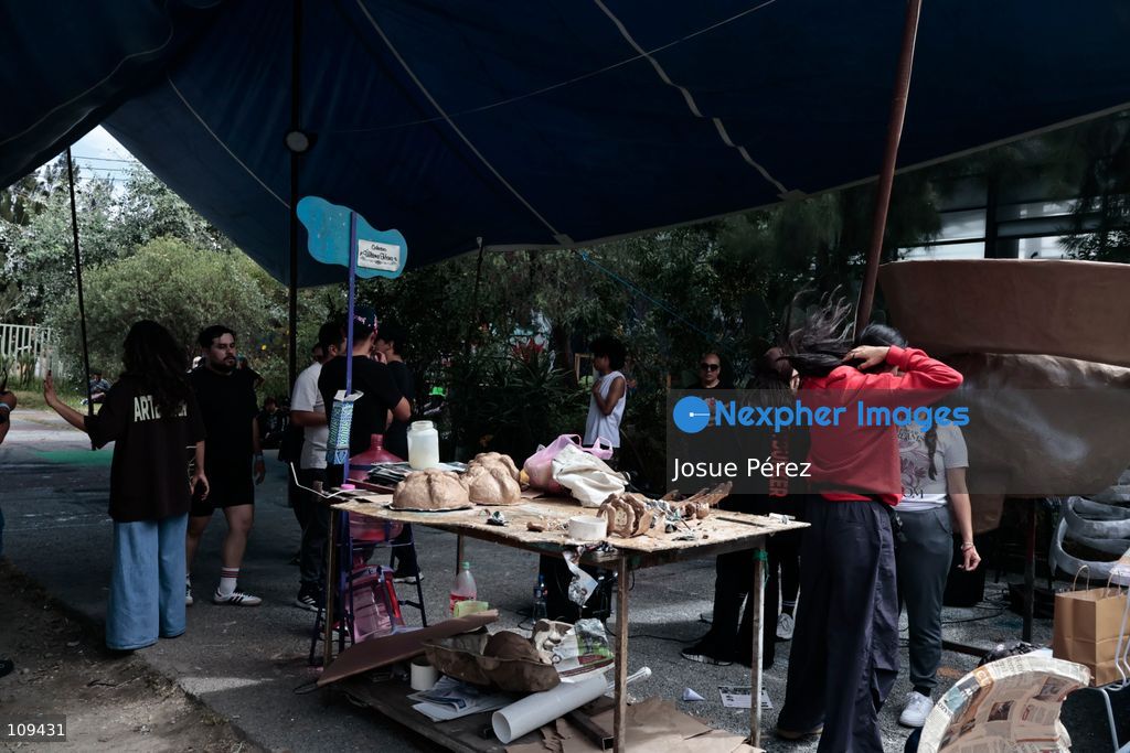 Pieces of the parade float for the Day of the Dead parade are being placed in various locations to keep them organized, on October 24, 2026, in Mexico City, Mexico. At the Arts and Trades Factory of the East (FARO de Oriente), located in the Iztapalapa district, one of the floats for the Day of the Dead parade is being constructed. Titled "Panadero con el pan" ("Baker with the Bread"), the float is being built by artisans who specialize in alebrijes (fantastical creatures) and cartonería (traditional papier-mache/cardboard craft). They are crafting skulls, calaveras (stylized skeletal figures), and pan de muerto (traditional Day of the Dead bread) to assemble the float, which will also feature cempasúchil (marigold) flowers. (Photo by Josue Pérez/Nexpher Images)