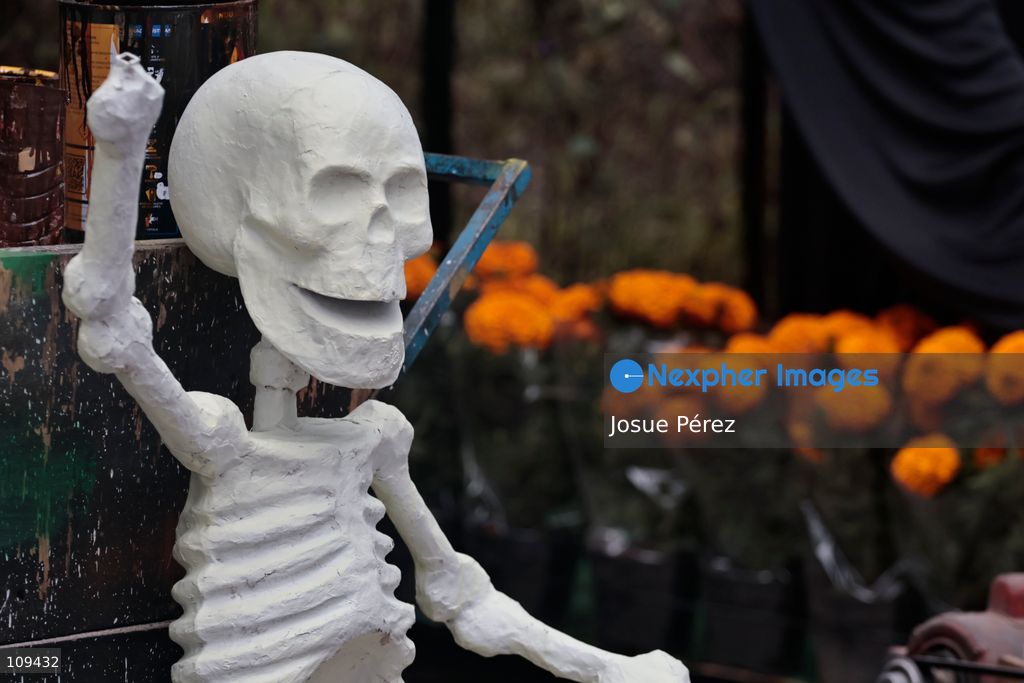 Pieces of the parade float for the Day of the Dead parade are being placed in various locations to keep them organized, on October 24, 2026, in Mexico City, Mexico. At the Arts and Trades Factory of the East (FARO de Oriente), located in the Iztapalapa district, one of the floats for the Day of the Dead parade is being constructed. Titled "Panadero con el pan" ("Baker with the Bread"), the float is being built by artisans who specialize in alebrijes (fantastical creatures) and cartonería (traditional papier-mache/cardboard craft). They are crafting skulls, calaveras (stylized skeletal figures), and pan de muerto (traditional Day of the Dead bread) to assemble the float, which will also feature cempasúchil (marigold) flowers. (Photo by Josue Pérez/Nexpher Images)