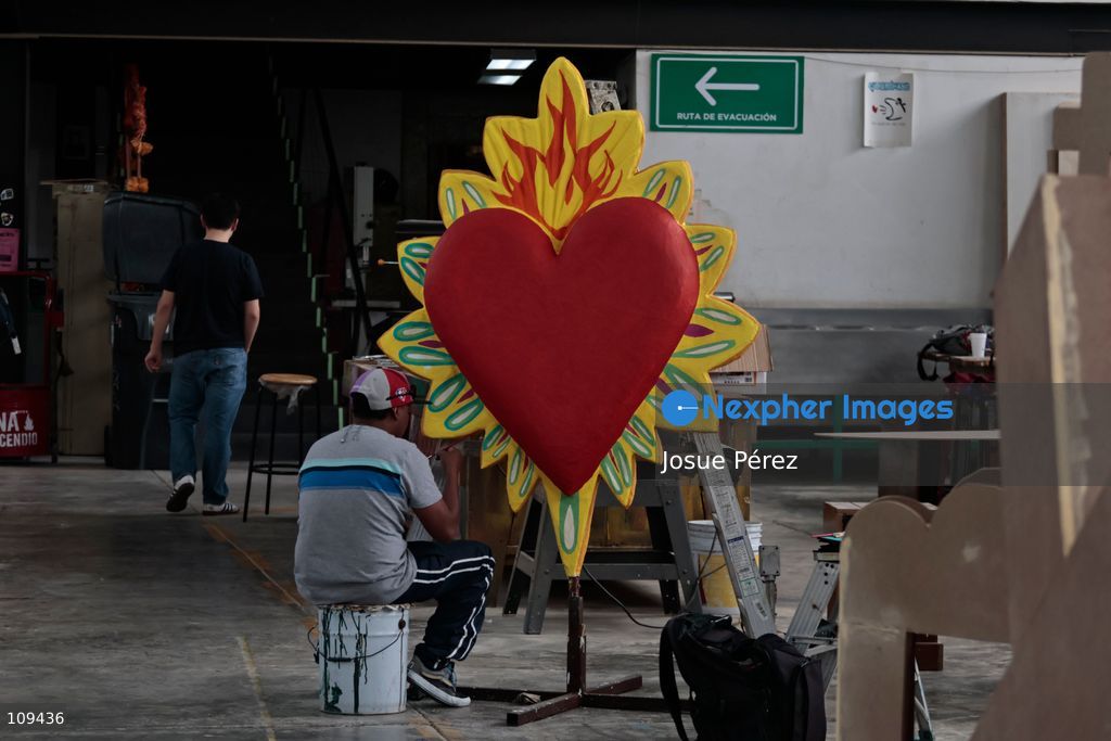 Pieces of the parade float for the Day of the Dead parade are being placed in various locations to keep them organized, on October 24, 2026, in Mexico City, Mexico. At the Arts and Trades Factory of the East (FARO de Oriente), located in the Iztapalapa district, one of the floats for the Day of the Dead parade is being constructed. Titled "Panadero con el pan" ("Baker with the Bread"), the float is being built by artisans who specialize in alebrijes (fantastical creatures) and cartonería (traditional papier-mache/cardboard craft). They are crafting skulls, calaveras (stylized skeletal figures), and pan de muerto (traditional Day of the Dead bread) to assemble the float, which will also feature cempasúchil (marigold) flowers. (Photo by Josue Pérez/Nexpher Images)