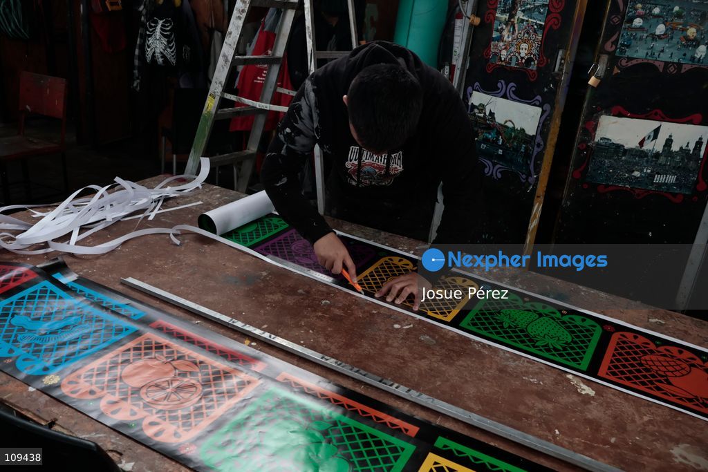Pieces of the parade float for the Day of the Dead parade are being placed in various locations to keep them organized, on October 24, 2026, in Mexico City, Mexico. At the Arts and Trades Factory of the East (FARO de Oriente), located in the Iztapalapa district, one of the floats for the Day of the Dead parade is being constructed. Titled "Panadero con el pan" ("Baker with the Bread"), the float is being built by artisans who specialize in alebrijes (fantastical creatures) and cartonería (traditional papier-mache/cardboard craft). They are crafting skulls, calaveras (stylized skeletal figures), and pan de muerto (traditional Day of the Dead bread) to assemble the float, which will also feature cempasúchil (marigold) flowers. (Photo by Josue Pérez/Nexpher Images)