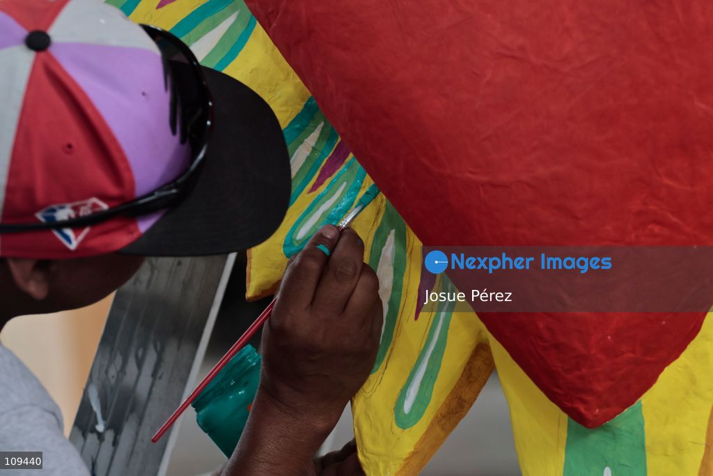 Pieces of the parade float for the Day of the Dead parade are being placed in various locations to keep them organized, on October 24, 2026, in Mexico City, Mexico. At the Arts and Trades Factory of the East (FARO de Oriente), located in the Iztapalapa district, one of the floats for the Day of the Dead parade is being constructed. Titled "Panadero con el pan" ("Baker with the Bread"), the float is being built by artisans who specialize in alebrijes (fantastical creatures) and cartonería (traditional papier-mache/cardboard craft). They are crafting skulls, calaveras (stylized skeletal figures), and pan de muerto (traditional Day of the Dead bread) to assemble the float, which will also feature cempasúchil (marigold) flowers. (Photo by Josue Pérez/Nexpher Images)