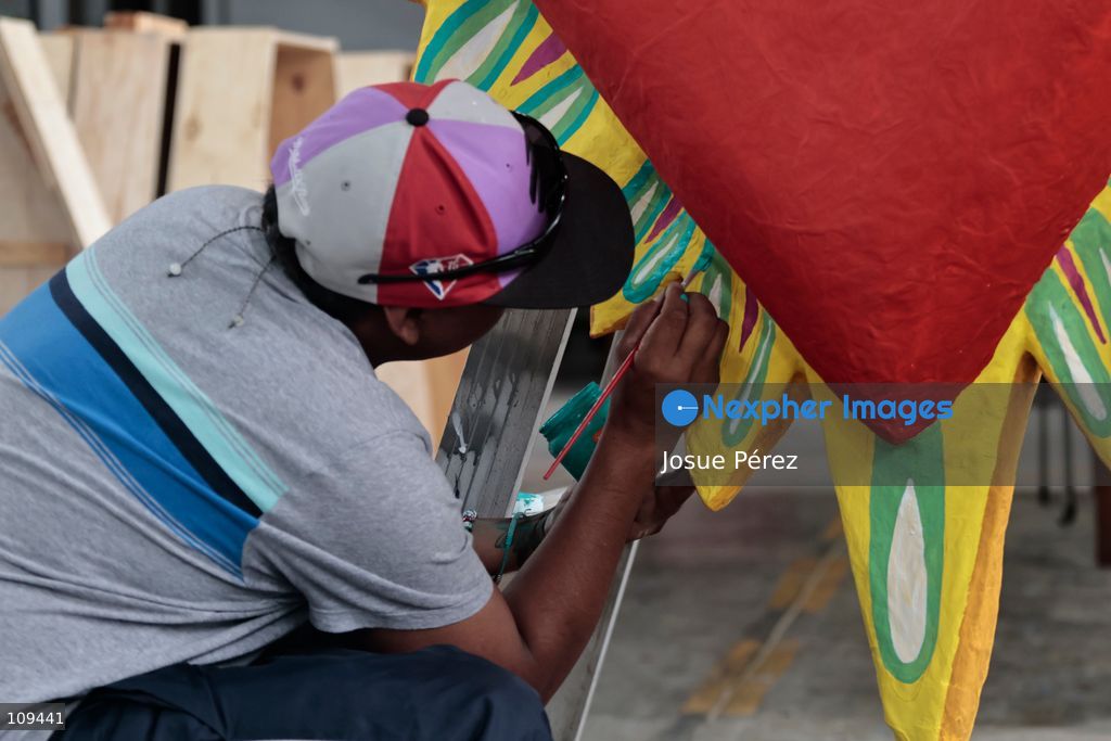 Pieces of the parade float for the Day of the Dead parade are being placed in various locations to keep them organized, on October 24, 2026, in Mexico City, Mexico. At the Arts and Trades Factory of the East (FARO de Oriente), located in the Iztapalapa district, one of the floats for the Day of the Dead parade is being constructed. Titled "Panadero con el pan" ("Baker with the Bread"), the float is being built by artisans who specialize in alebrijes (fantastical creatures) and cartonería (traditional papier-mache/cardboard craft). They are crafting skulls, calaveras (stylized skeletal figures), and pan de muerto (traditional Day of the Dead bread) to assemble the float, which will also feature cempasúchil (marigold) flowers. (Photo by Josue Pérez/Nexpher Images)