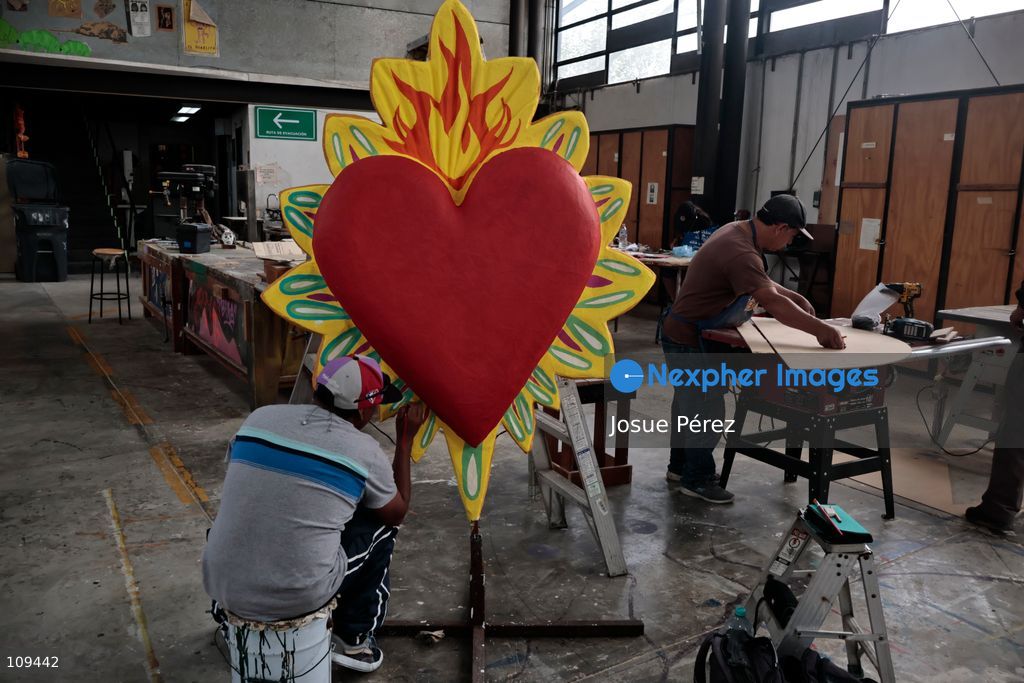 Pieces of the parade float for the Day of the Dead parade are being placed in various locations to keep them organized, on October 24, 2026, in Mexico City, Mexico. At the Arts and Trades Factory of the East (FARO de Oriente), located in the Iztapalapa district, one of the floats for the Day of the Dead parade is being constructed. Titled "Panadero con el pan" ("Baker with the Bread"), the float is being built by artisans who specialize in alebrijes (fantastical creatures) and cartonería (traditional papier-mache/cardboard craft). They are crafting skulls, calaveras (stylized skeletal figures), and pan de muerto (traditional Day of the Dead bread) to assemble the float, which will also feature cempasúchil (marigold) flowers. (Photo by Josue Pérez/Nexpher Images)