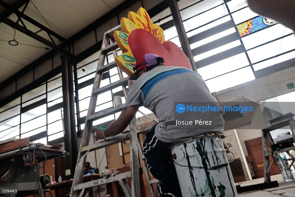 Pieces of the parade float for the Day of the Dead parade are being placed in various locations to keep them organized, on October 24, 2026, in Mexico City, Mexico. At the Arts and Trades Factory of the East (FARO de Oriente), located in the Iztapalapa district, one of the floats for the Day of the Dead parade is being constructed. Titled "Panadero con el pan" ("Baker with the Bread"), the float is being built by artisans who specialize in alebrijes (fantastical creatures) and cartonería (traditional papier-mache/cardboard craft). They are crafting skulls, calaveras (stylized skeletal figures), and pan de muerto (traditional Day of the Dead bread) to assemble the float, which will also feature cempasúchil (marigold) flowers. (Photo by Josue Pérez/Nexpher Images)