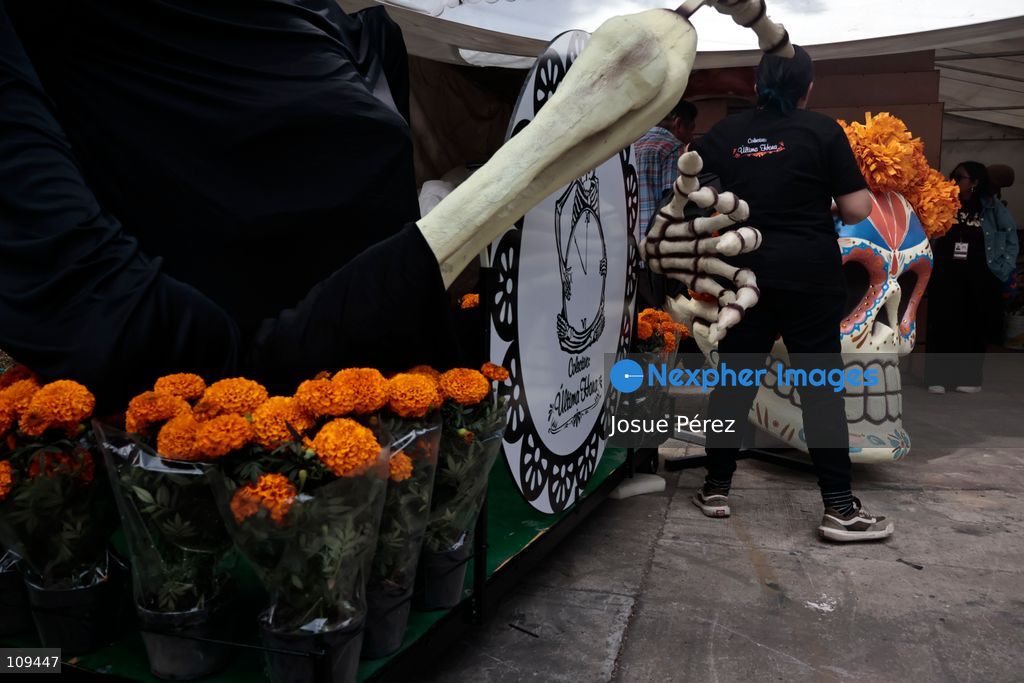 Pieces of the parade float for the Day of the Dead parade are being placed in various locations to keep them organized, on October 24, 2026, in Mexico City, Mexico. At the Arts and Trades Factory of the East (FARO de Oriente), located in the Iztapalapa district, one of the floats for the Day of the Dead parade is being constructed. Titled "Panadero con el pan" ("Baker with the Bread"), the float is being built by artisans who specialize in alebrijes (fantastical creatures) and cartonería (traditional papier-mache/cardboard craft). They are crafting skulls, calaveras (stylized skeletal figures), and pan de muerto (traditional Day of the Dead bread) to assemble the float, which will also feature cempasúchil (marigold) flowers. (Photo by Josue Pérez/Nexpher Images)