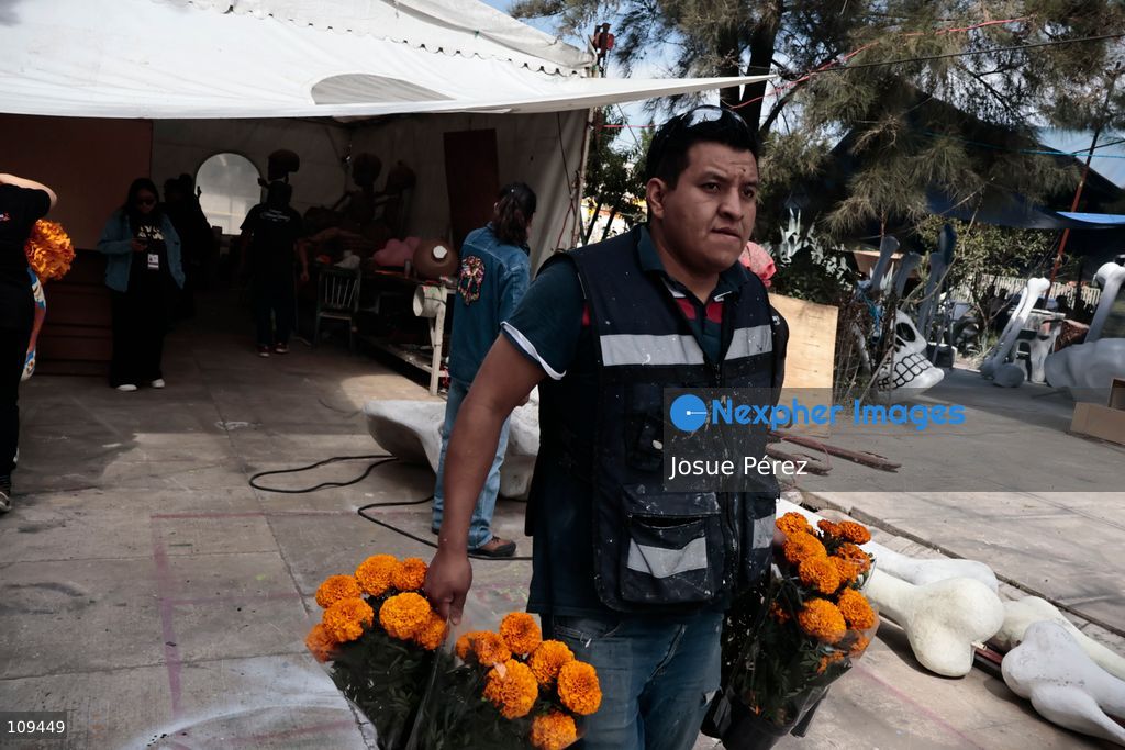 Pieces of the parade float for the Day of the Dead parade are being placed in various locations to keep them organized, on October 24, 2026, in Mexico City, Mexico. At the Arts and Trades Factory of the East (FARO de Oriente), located in the Iztapalapa district, one of the floats for the Day of the Dead parade is being constructed. Titled "Panadero con el pan" ("Baker with the Bread"), the float is being built by artisans who specialize in alebrijes (fantastical creatures) and cartonería (traditional papier-mache/cardboard craft). They are crafting skulls, calaveras (stylized skeletal figures), and pan de muerto (traditional Day of the Dead bread) to assemble the float, which will also feature cempasúchil (marigold) flowers. (Photo by Josue Pérez/Nexpher Images)