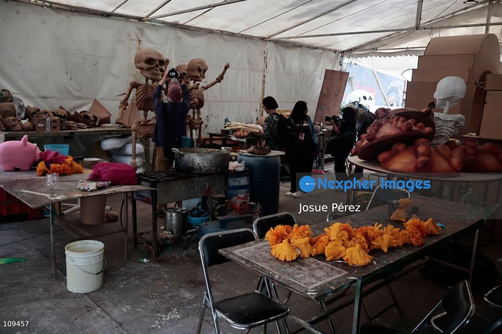 Pieces of the parade float for the Day of the Dead parade are being placed in various locations to keep them organized, on October 24, 2026, in Mexico City, Mexico. At the Arts and Trades Factory of the East (FARO de Oriente), located in the Iztapalapa district, one of the floats for the Day of the Dead parade is being constructed. Titled "Panadero con el pan" ("Baker with the Bread"), the float is being built by artisans who specialize in alebrijes (fantastical creatures) and cartonería (traditional papier-mache/cardboard craft). They are crafting skulls, calaveras (stylized skeletal figures), and pan de muerto (traditional Day of the Dead bread) to assemble the float, which will also feature cempasúchil (marigold) flowers. (Photo by Josue Pérez/Nexpher Images)