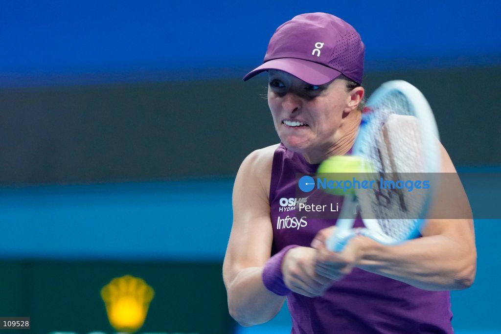 Iga Swiatek of Poland in action against Elise Mertens of Belgium during their women's singles quarter-final match on day ten of China Open at the National Tennis Center on October 9, 2026 in Beijing, China. (Photo by Peter Li/Nexpher Images)