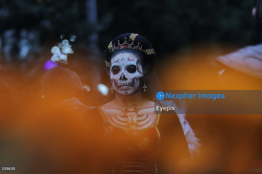 A participant dressed and painted as a traditional 'Catrina' takes part during the 13th annual Mega Procession of Catrinas along Paseo de la Reforma avenue. Thousands of persons gathered for the massive parade, a key cultural prelude to the upcoming Day of the Dead (Día de Muertos) celebrations, showcasing elaborate makeup, vibrant costumes, and honoring Mexican skull iconography. on October 25, 2026 in Mexico City, Mexico. (Photo by Carlos Santiago/ Eyepix Group/Eyepix via Nexpher Images)