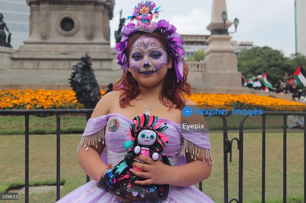 A woman with her face painted with Catrina makeup takes part during the 13th annual Mega Procession of Catrinas along Paseo de la Reforma avenue. Thousands of persons gathered for the massive parade, a key cultural prelude to the upcoming Day of the Dead (Día de Muertos) celebrations, showcasing elaborate makeup, vibrant costumes, and honoring Mexican skull iconography. on October 25, 2026 in Mexico City, Mexico. (Photo by Carlos Santiago/ Eyepix Group/Eyepix via Nexpher Images)