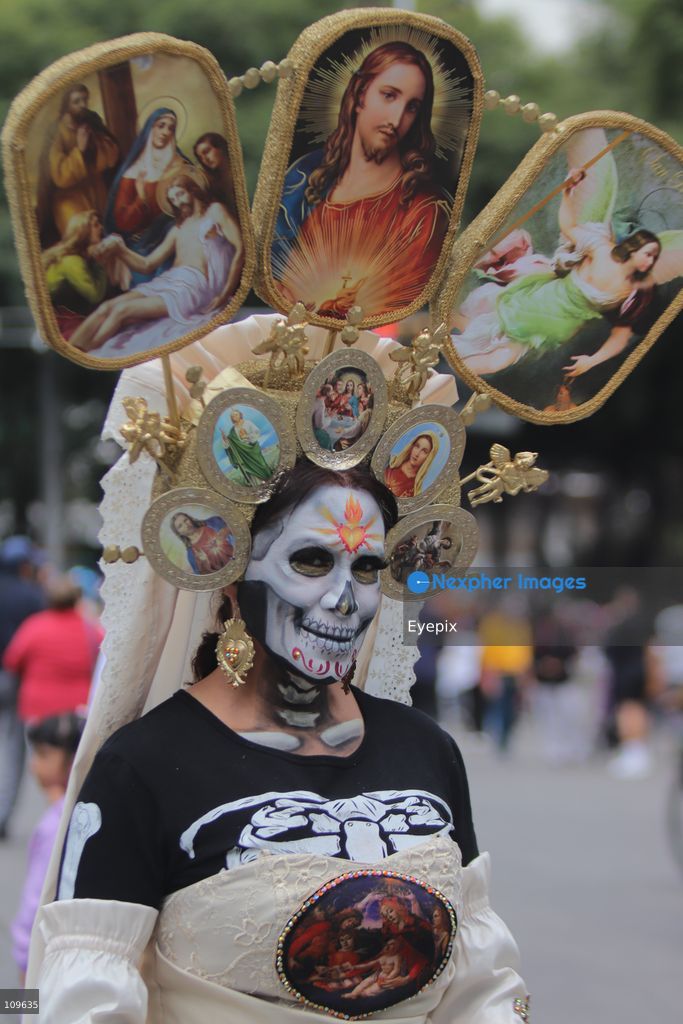 A participant dressed and painted as a traditional 'Catrina' takes part during the 13th annual Mega Procession of Catrinas along Paseo de la Reforma avenue. Thousands of persons gathered for the massive parade, a key cultural prelude to the upcoming Day of the Dead (Día de Muertos) celebrations, showcasing elaborate makeup, vibrant costumes, and honoring Mexican skull iconography. on October 25, 2026 in Mexico City, Mexico. (Photo by Carlos Santiago/ Eyepix Group/Eyepix via Nexpher Images)
