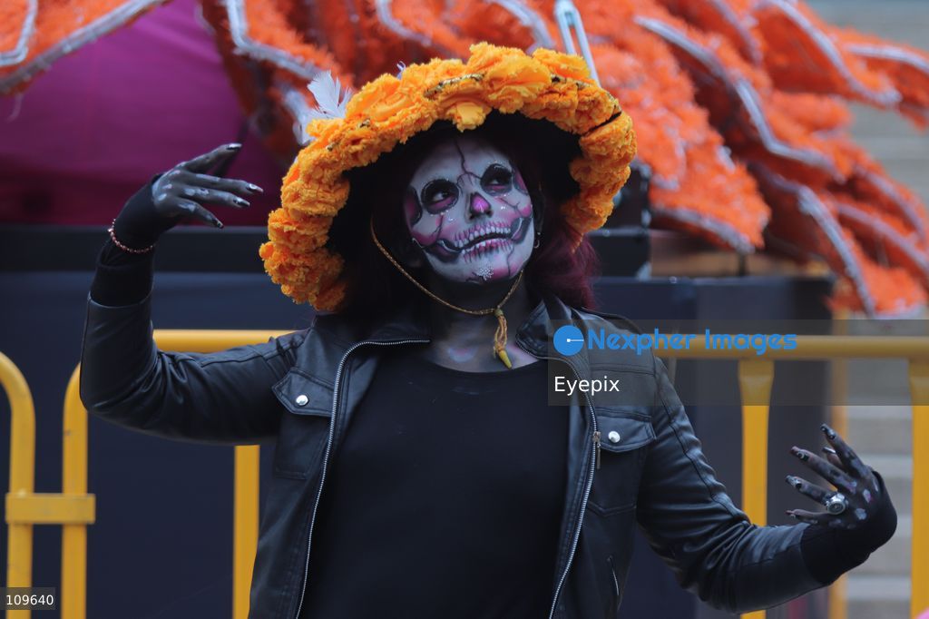 A participant with her face painted with skull makeup takes part during the 13th annual Mega Procession of Catrinas along Paseo de la Reforma avenue. Thousands of persons gathered for the massive parade, a key cultural prelude to the upcoming Day of the Dead (Día de Muertos) celebrations, showcasing elaborate makeup, vibrant costumes, and honoring Mexican skull iconography. on October 25, 2026 in Mexico City, Mexico. (Photo by Carlos Santiago/ Eyepix Group/Eyepix via Nexpher Images)