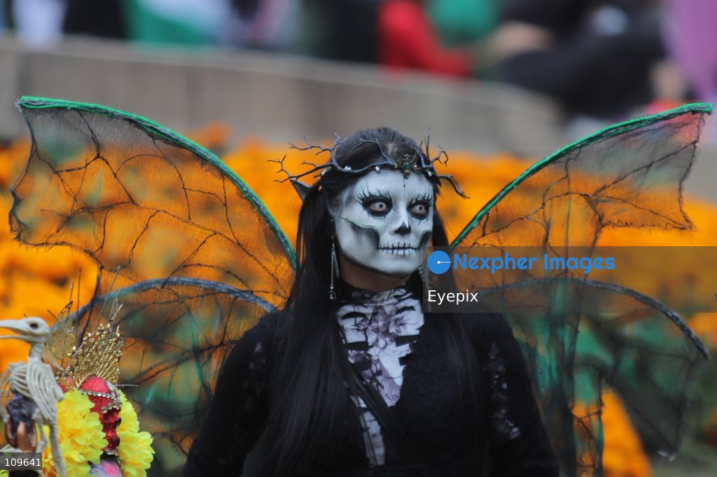 A participant with her face painted with skull makeup takes part during the 13th annual Mega Procession of Catrinas along Paseo de la Reforma avenue. Thousands of persons gathered for the massive parade, a key cultural prelude to the upcoming Day of the Dead (Día de Muertos) celebrations, showcasing elaborate makeup, vibrant costumes, and honoring Mexican skull iconography. on October 25, 2026 in Mexico City, Mexico. (Photo by Carlos Santiago/ Eyepix Group/Eyepix via Nexpher Images)