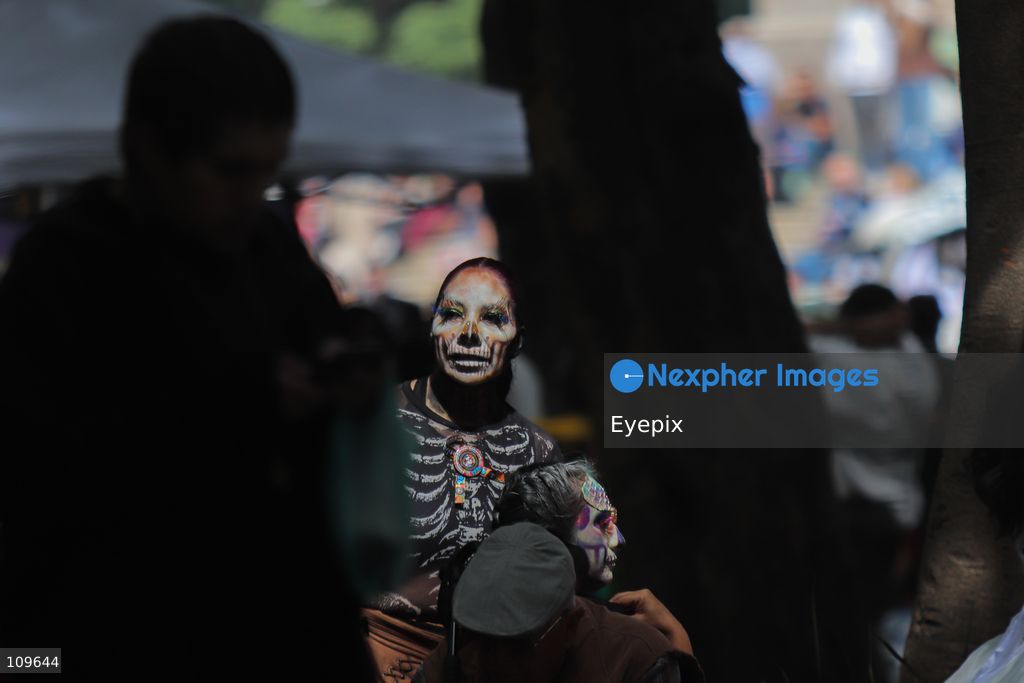 A participant with her face painted with skull makeup takes part during the 13th annual Mega Procession of Catrinas along Paseo de la Reforma avenue. Thousands of persons gathered for the massive parade, a key cultural prelude to the upcoming Day of the Dead (Día de Muertos) celebrations, showcasing elaborate makeup, vibrant costumes, and honoring Mexican skull iconography. on October 25, 2026 in Mexico City, Mexico. (Photo by Carlos Santiago/ Eyepix Group/Eyepix via Nexpher Images)
