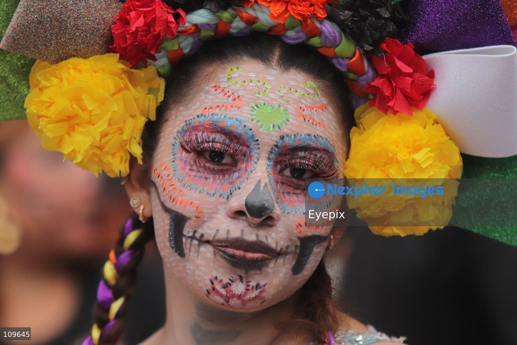 A woman with her face painted with Catrina makeup takes part during the 13th annual Mega Procession of Catrinas along Paseo de la Reforma avenue. Thousands of persons gathered for the massive parade, a key cultural prelude to the upcoming Day of the Dead (Día de Muertos) celebrations, showcasing elaborate makeup, vibrant costumes, and honoring Mexican skull iconography. on October 25, 2026 in Mexico City, Mexico. (Photo by Carlos Santiago/ Eyepix Group/Eyepix via Nexpher Images)