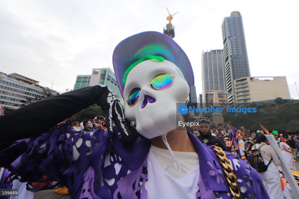 A Participant takes part during the 13th annual Mega Procession of Catrinas along Paseo de la Reforma avenue. Thousands of persons gathered for the massive parade, a key cultural prelude to the upcoming Day of the Dead (Día de Muertos) celebrations, showcasing elaborate makeup, vibrant costumes, and honoring Mexican skull iconography. on October 25, 2026 in Mexico City, Mexico. (Photo by Carlos Santiago/ Eyepix Group/Eyepix via Nexpher Images)