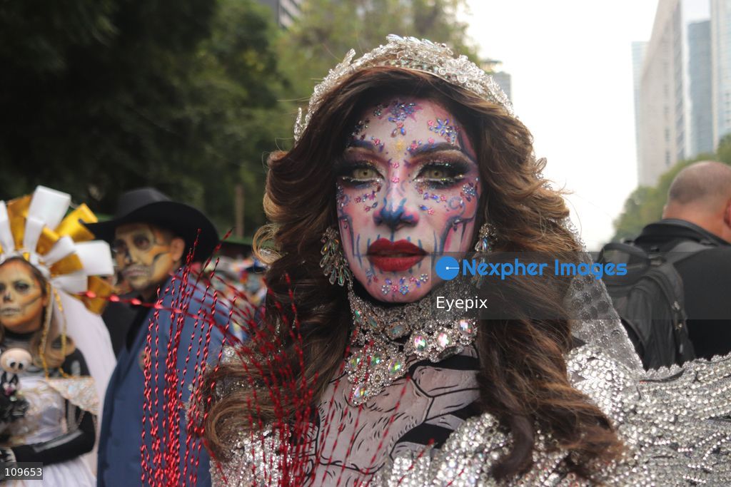A participant dressed and painted as a traditional 'Catrina' takes part during the 13th annual Mega Procession of Catrinas along Paseo de la Reforma avenue. Thousands of persons gathered for the massive parade, a key cultural prelude to the upcoming Day of the Dead (Día de Muertos) celebrations, showcasing elaborate makeup, vibrant costumes, and honoring Mexican skull iconography. on October 25, 2026 in Mexico City, Mexico. (Photo by Carlos Santiago/ Eyepix Group/Eyepix via Nexpher Images)