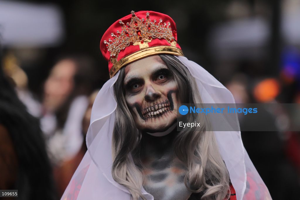 A woman with her face painted with Catrina makeup takes part during the 13th annual Mega Procession of Catrinas along Paseo de la Reforma avenue. Thousands of persons gathered for the massive parade, a key cultural prelude to the upcoming Day of the Dead (Día de Muertos) celebrations, showcasing elaborate makeup, vibrant costumes, and honoring Mexican skull iconography. on October 25, 2026 in Mexico City, Mexico. (Photo by Carlos Santiago/ Eyepix Group/Eyepix via Nexpher Images)