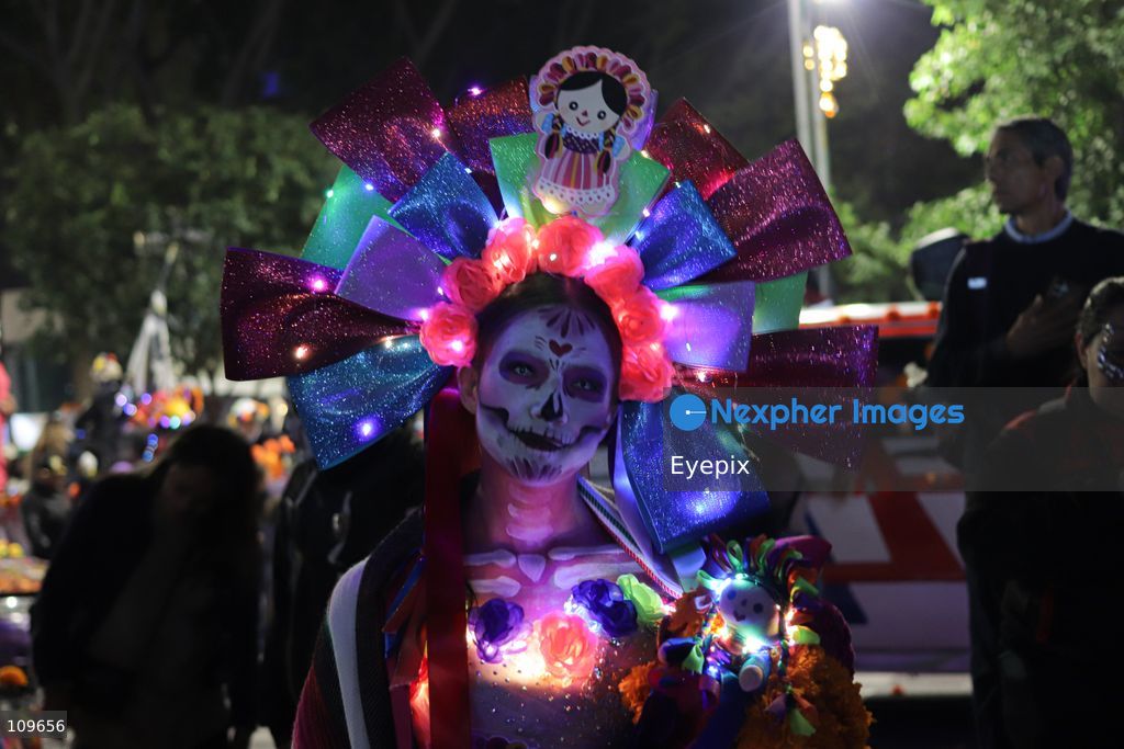 A Participant takes part during the 13th annual Mega Procession of Catrinas along Paseo de la Reforma avenue. Thousands of persons gathered for the massive parade, a key cultural prelude to the upcoming Day of the Dead (Día de Muertos) celebrations, showcasing elaborate makeup, vibrant costumes, and honoring Mexican skull iconography. on October 25, 2026 in Mexico City, Mexico. (Photo by Carlos Santiago/ Eyepix Group/Eyepix via Nexpher Images)