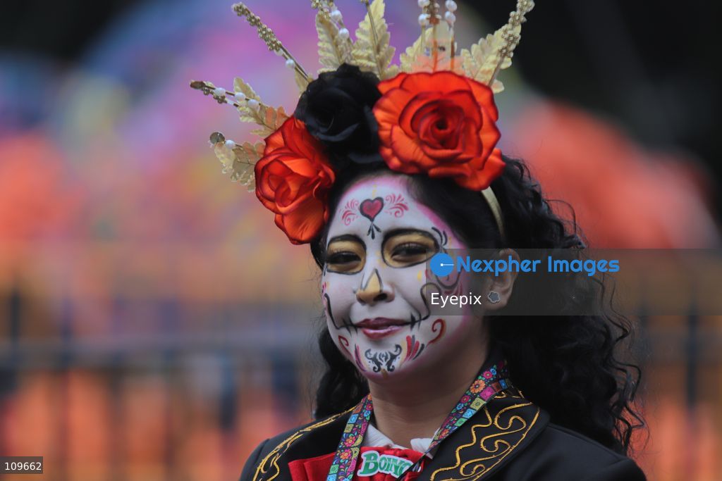 A woman with her face painted with Catrina makeup takes part during the 13th annual Mega Procession of Catrinas along Paseo de la Reforma avenue. Thousands of persons gathered for the massive parade, a key cultural prelude to the upcoming Day of the Dead (Día de Muertos) celebrations, showcasing elaborate makeup, vibrant costumes, and honoring Mexican skull iconography. on October 25, 2026 in Mexico City, Mexico. (Photo by Carlos Santiago/ Eyepix Group/Eyepix via Nexpher Images)