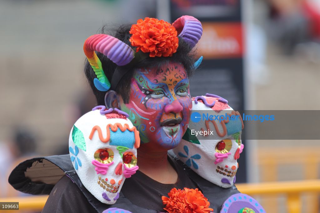 A woman with her face painted takes part during the 13th annual Mega Procession of Catrinas along Paseo de la Reforma avenue. Thousands of persons gathered for the massive parade, a key cultural prelude to the upcoming Day of the Dead (Día de Muertos) celebrations, showcasing elaborate makeup, vibrant costumes, and honoring Mexican skull iconography. on October 25, 2026 in Mexico City, Mexico. (Photo by Carlos Santiago/ Eyepix Group/Eyepix via Nexpher Images)